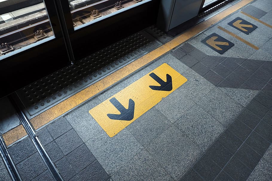 Yellow Arrow Symbol, architecture, city, design, entrance, exit HD wallpaper