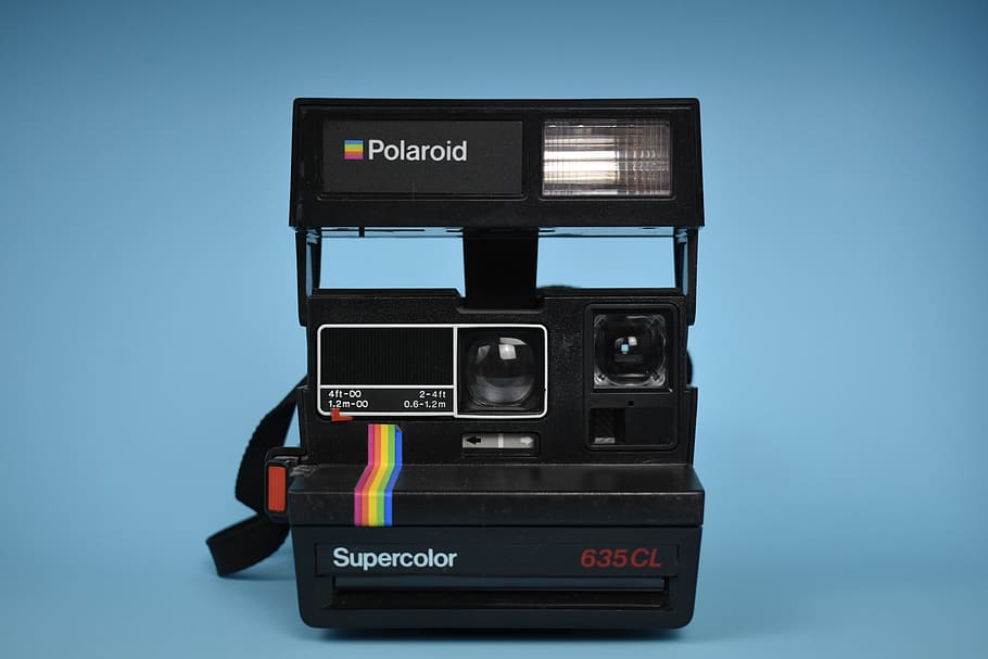 black Polaroid camera illustration, studio shot, technology, indoors