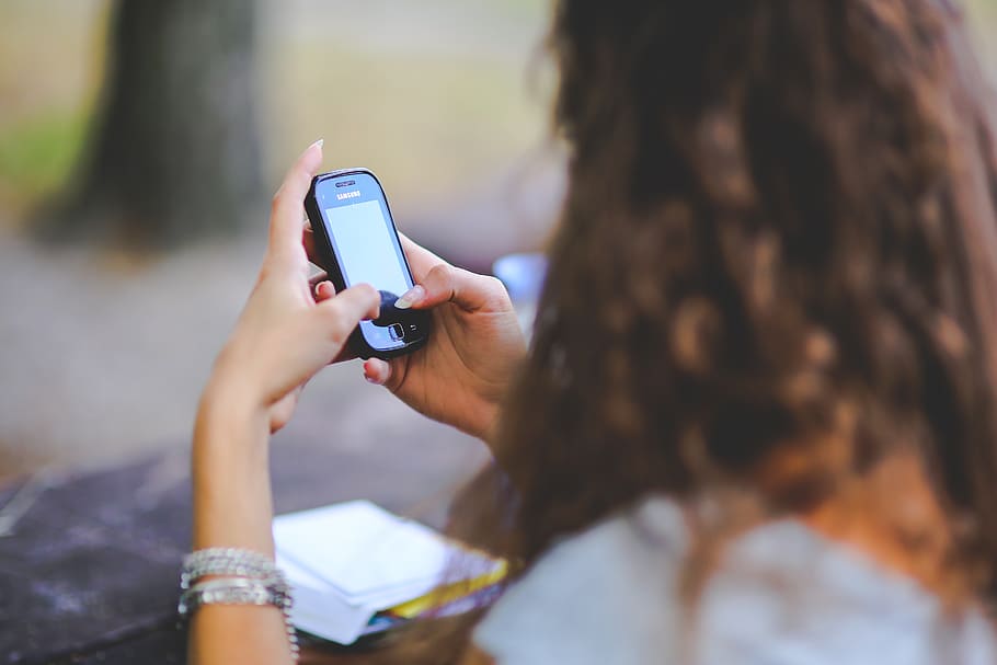 Girl and cell phone, smartphone, technology, typing, wireless technology HD wallpaper