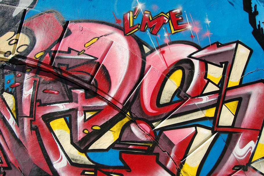 Red and yellow graffiti writing on a wall., wall street art in a public place, HD wallpaper