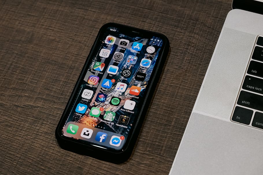 space gray iPhone turned-on beside MacBook, wireless technology HD wallpaper