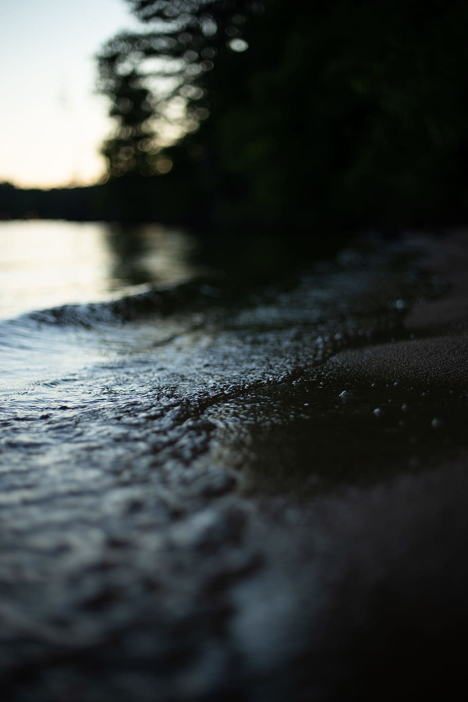 selective focus photography of water crashing on land at daytime HD wallpaper
