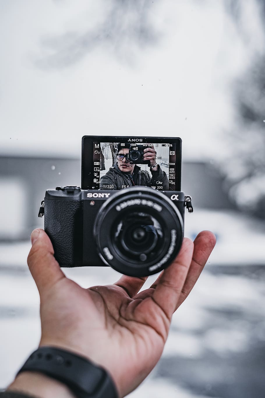 black DSLR camera, human hand, photography themes, technology HD wallpaper