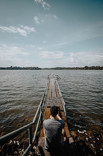 man sitting on small dock during daytime, water, human, person HD wallpaper