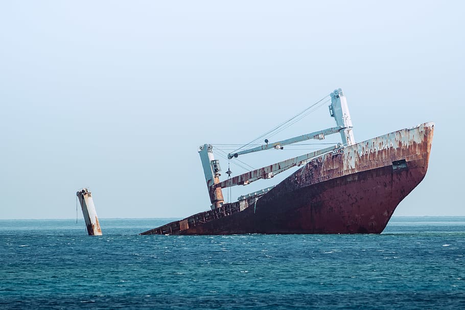 ship sinking on ocean at daytime, vessel, freighter, watercraft HD wallpaper