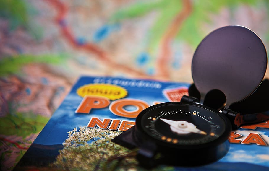 Round Black Analog Compass on Blue Labeled Box, adventure, blur HD wallpaper