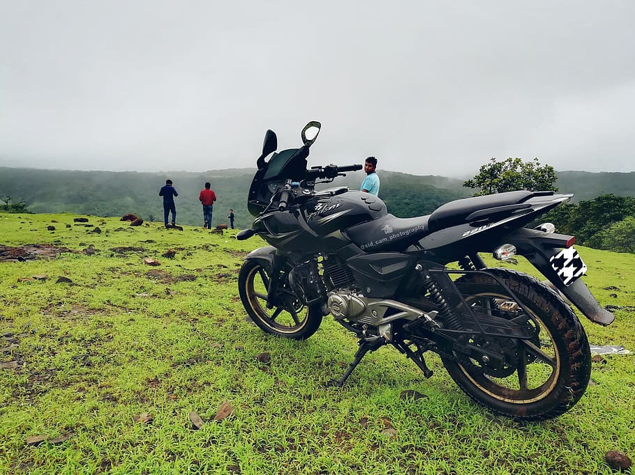 Black Backbone Motorcycle Near Man in Blue Shirt at Daytime, adventure HD wallpaper