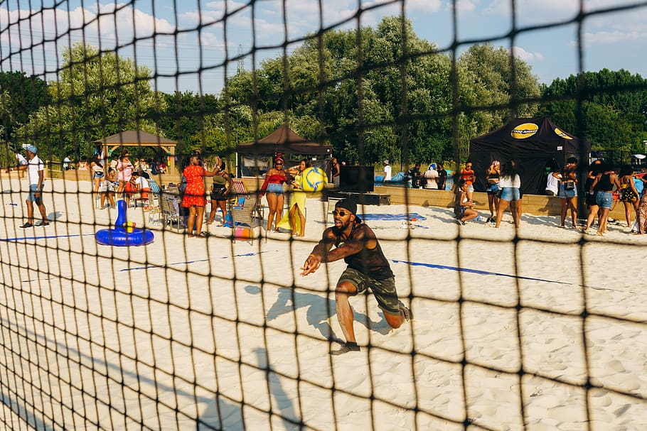 man playing beach volleyball, real people, group of people, large group of people HD wallpaper