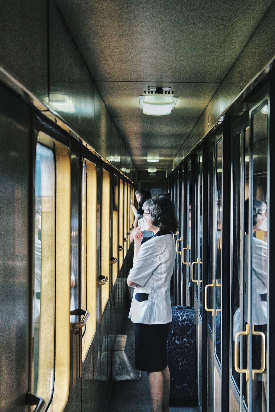 woman standing inside train facing window, one person, real people HD wallpaper