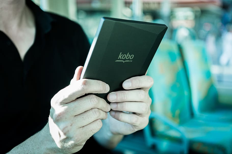 Person Holding Black Kobo Tablet, e-book, e-reader, ebook, electronics HD wallpaper