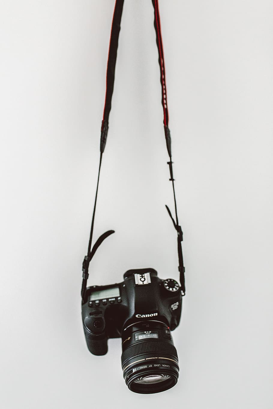black Canon DSLR camera, studio shot, technology, hanging, indoors HD wallpaper