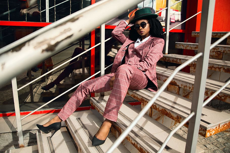 Woman Wearing Pink Suit Jacket and Pants Sitting on Staircase HD wallpaper