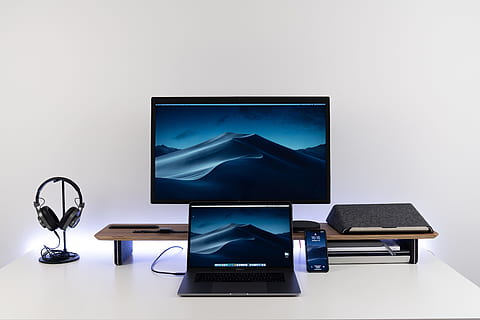black laptop computer under black flat screen TV, desk, screen saver HD wallpaper