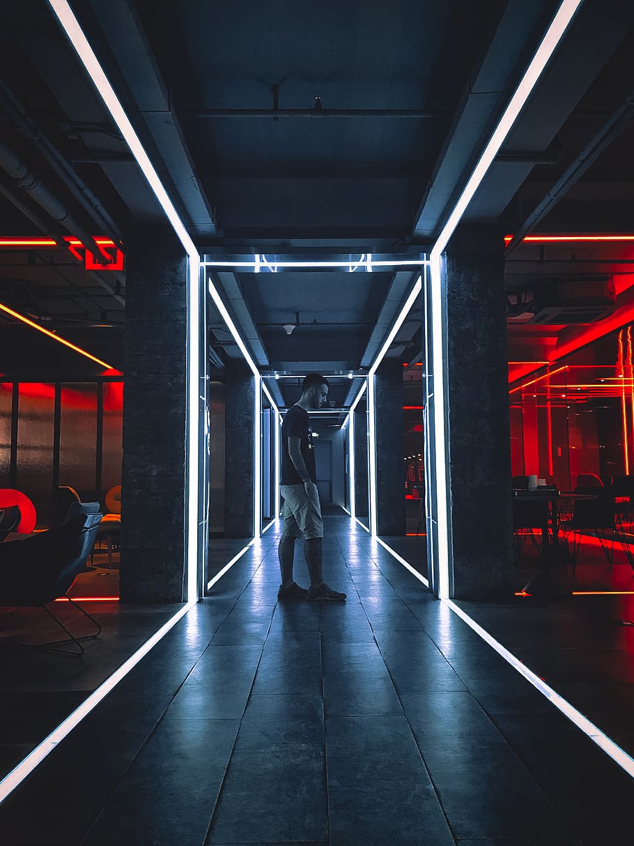 man standing on hallway, illuminated, architecture, real people HD wallpaper