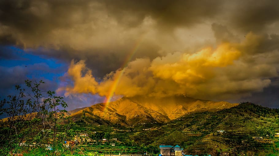 landscape, dark, sky, clouds, mountain, rainbow, houses, trees HD wallpaper