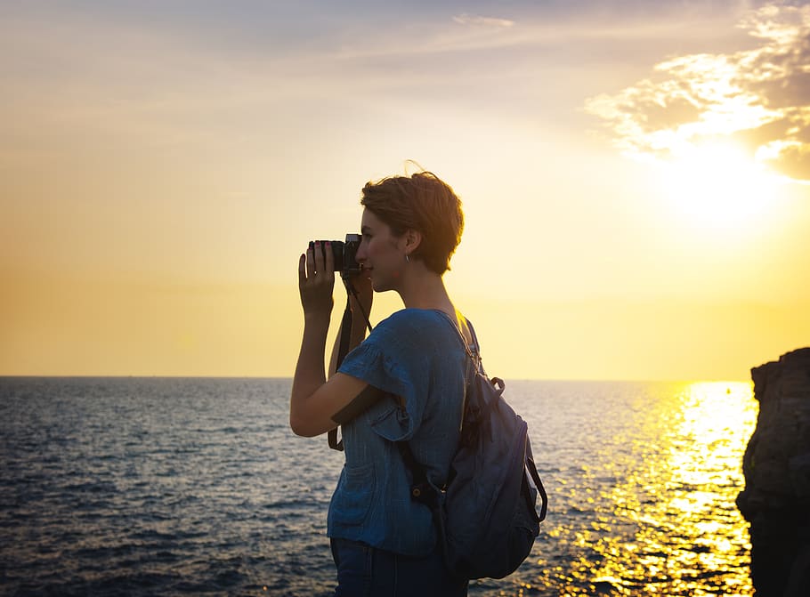 Woman Holding Camera, beach, calm, coast, coastline, dawn, girl HD wallpaper