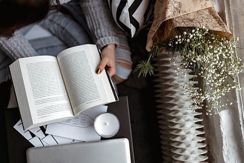 A woman in a sweater reads a book, reading, reader, opened book HD wallpaper