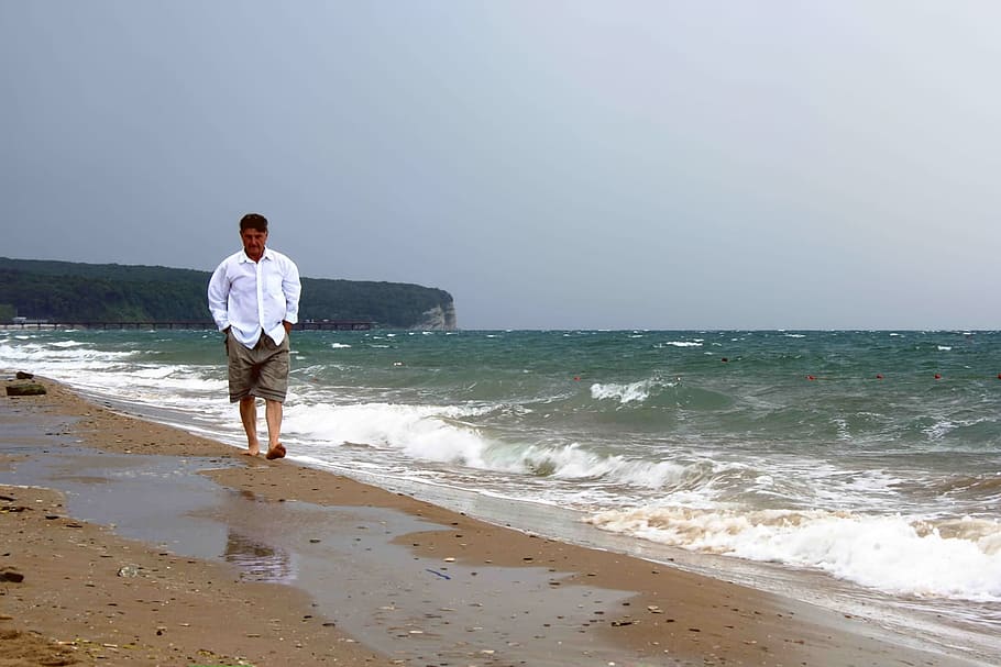 man, sea, beach, walking, waves, nature, male, water, land HD wallpaper