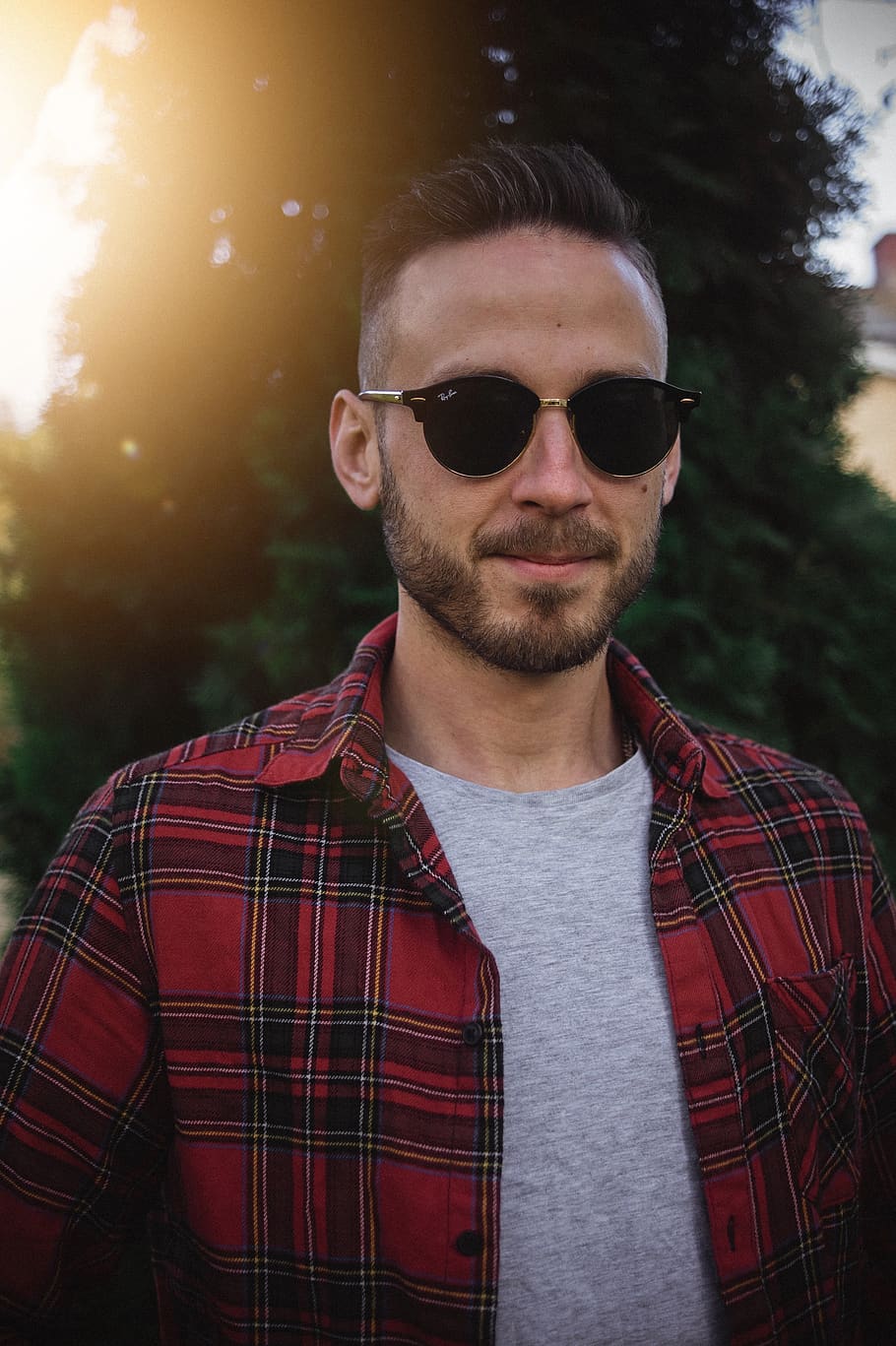 man wearing black sunglasses and plaid shirt, person, people