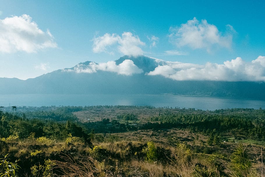 cloud covered mountain peak across sea, nature, outdoors, weather HD wallpaper
