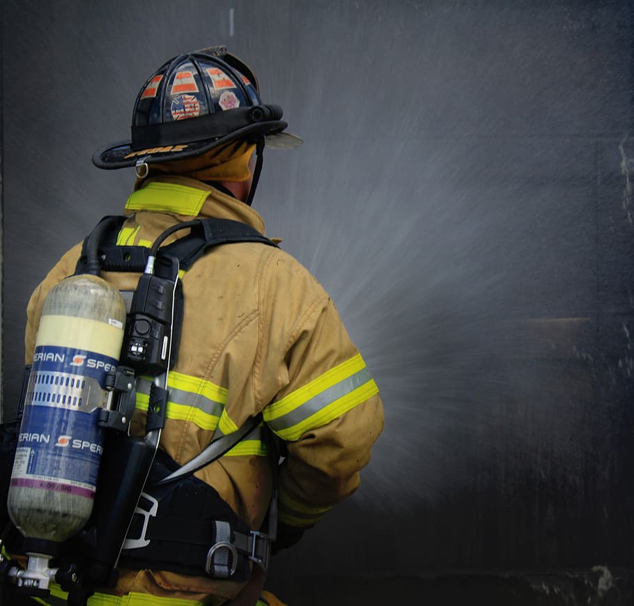 HD wallpaper firelighter with fire background firefighter portrait  training  Wallpaper Flare