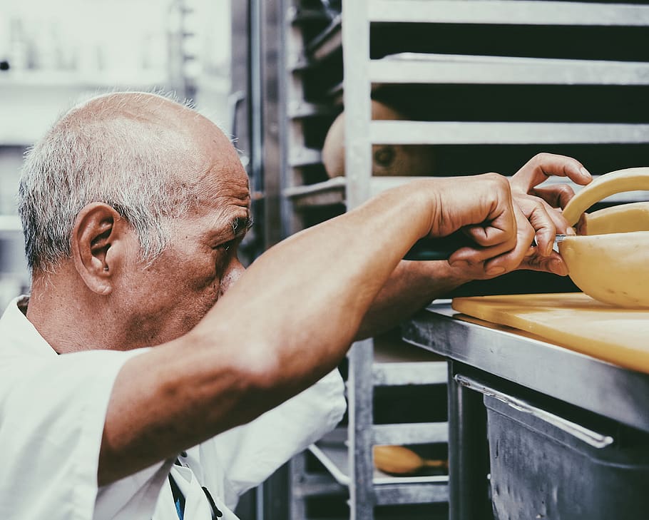 man beside bakery rack, one person, real people, men, adult, indoors HD wallpaper