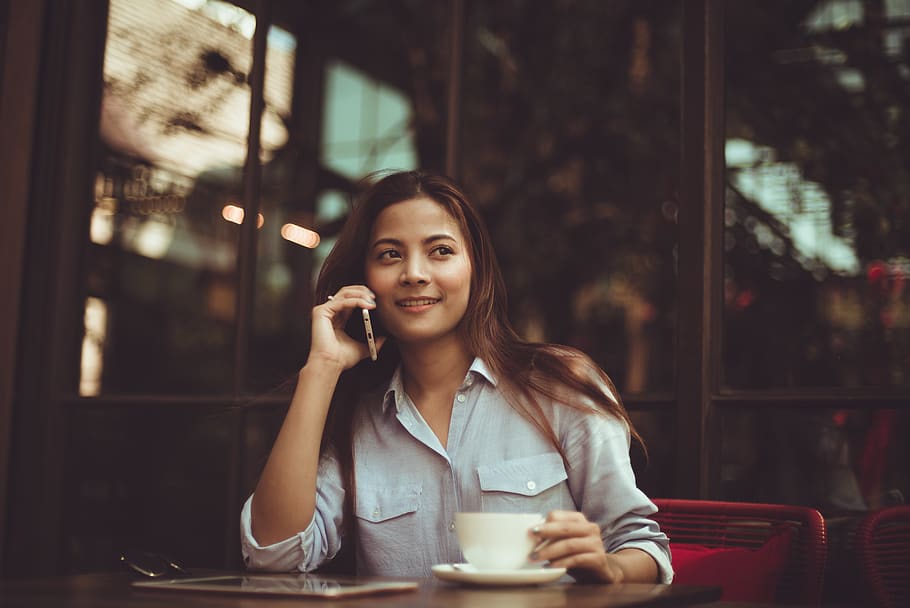 Portrait of Young Woman Using Mobile Phone in Cafe, adult, Asian