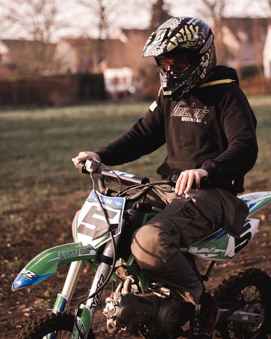 man-in-black-hoodie-riding-dirt-bike-during-daytime.jpg