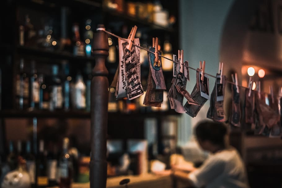 photo clipped on string, person, human, pub, bar counter, accessories