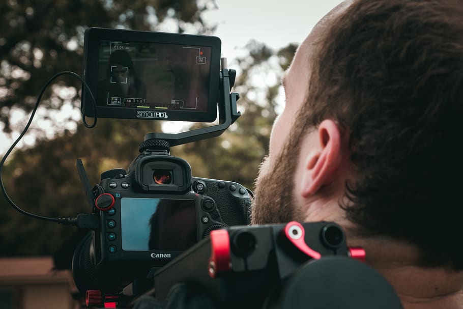 man taking photo using DSLR camera, technology, camera - photographic equipment HD wallpaper