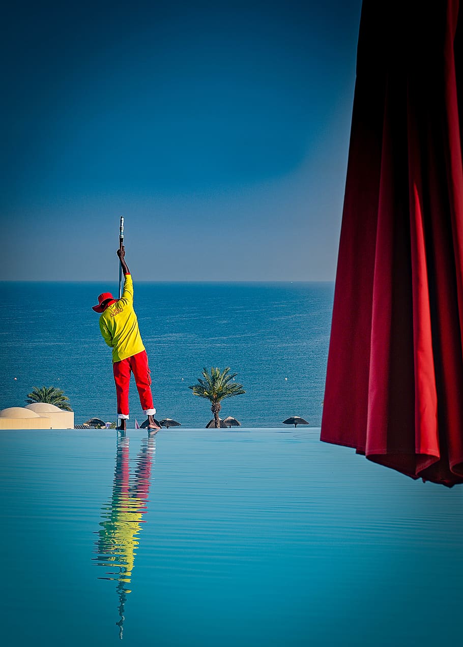 Man Standing Beside Pool, beach, cleaner, infinity pool, Infinity pool cleaner, HD wallpaper