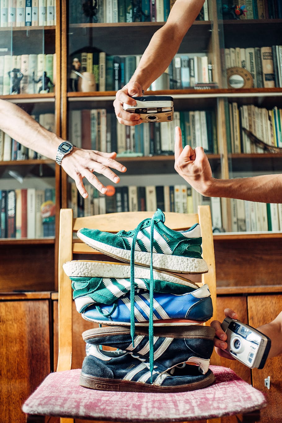 person holding silver camera, shoe, belarus, viciebsk, interior design HD wallpaper