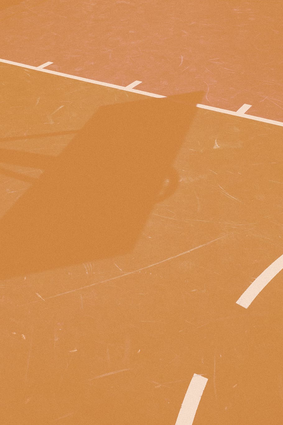 basketball hoop casting shadow on line, canada, montreal, court