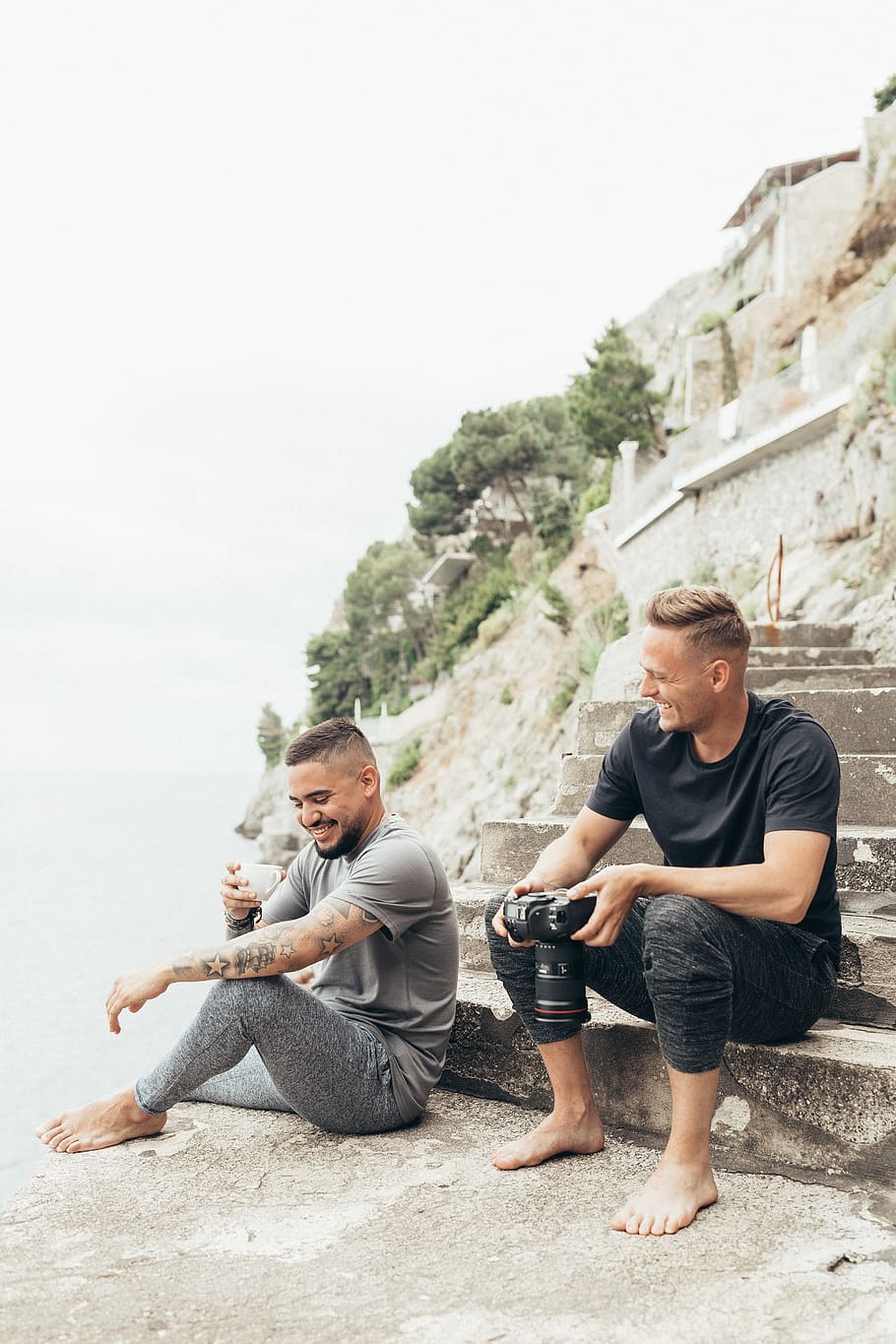 two man sitting while smiling at daytime, full length, men, young men HD wallpaper