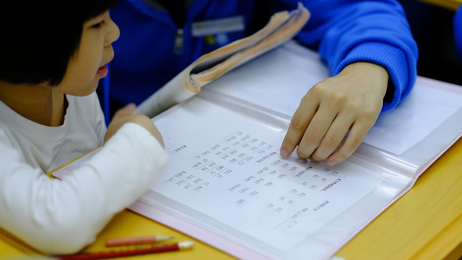 person teaching girl using book, learning, education, occupation HD wallpaper