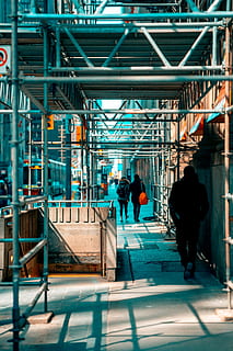 Man Walking Under Scaffolding, building, city, cleaning, commerce HD wallpaper