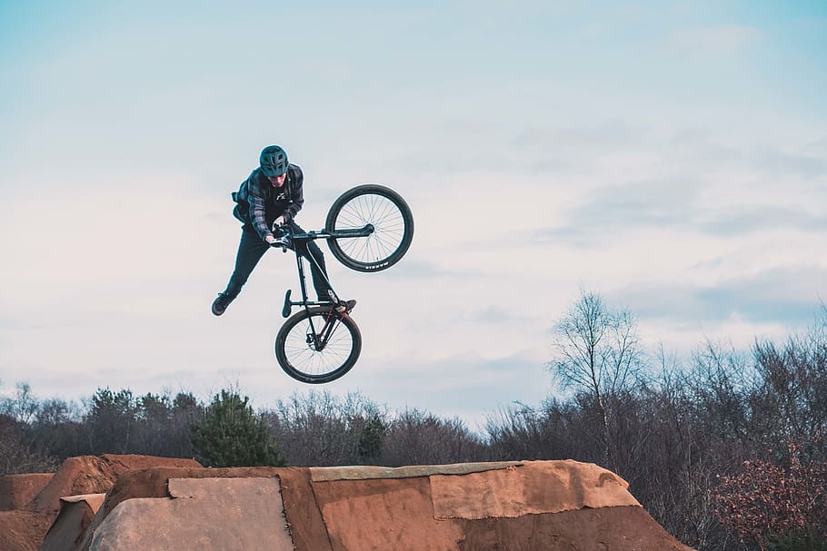 man using bicycle on mid air, extreme sports, one person, mid-air HD wallpaper
