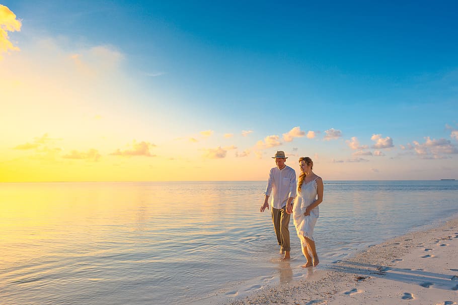 Couple Walking on Seashore Wearing White Tops during Sunset, affair