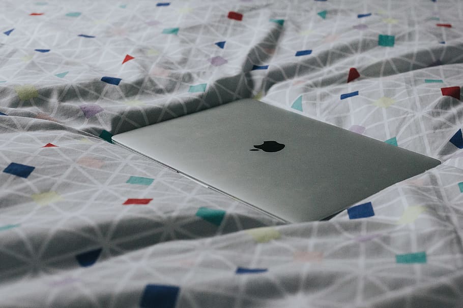 silver MacBook on assorted-color textile, grey, macbook pro, bed HD wallpaper