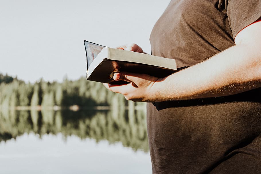 man holding brown book, person, human, reading, clothing, apparel HD wallpaper