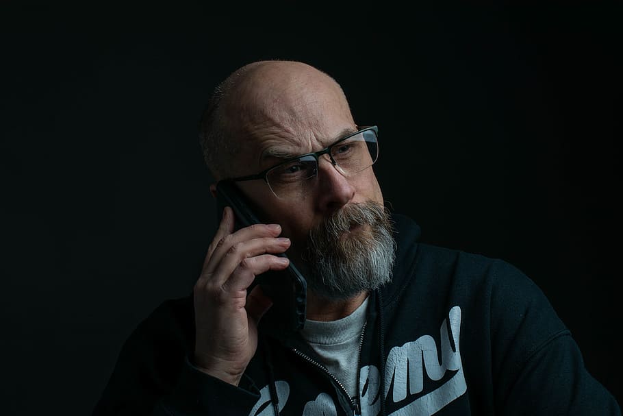 Man Holding Phone And Wearing Eyeglasses, bald, communication HD wallpaper
