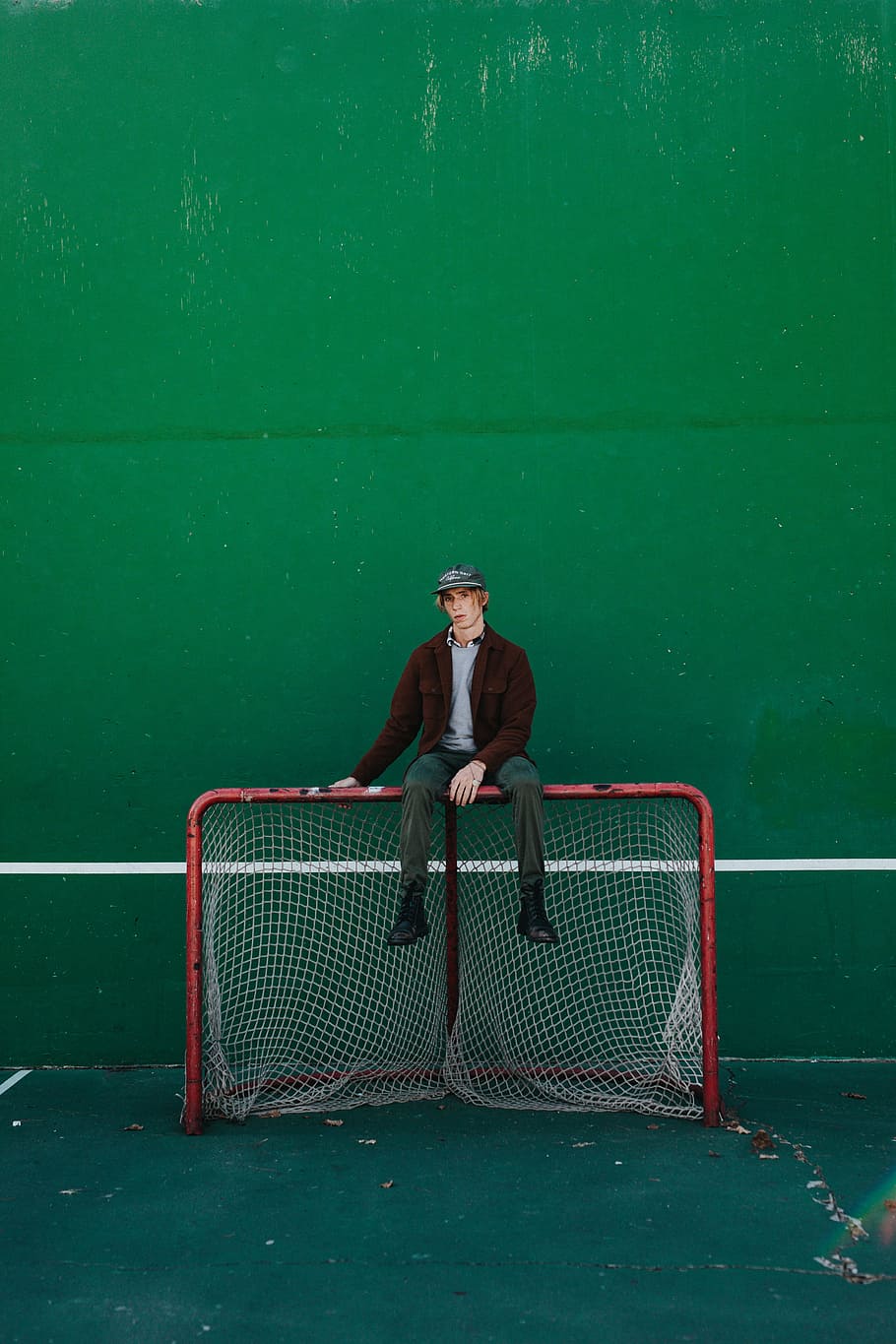 man sitting red net goal, soccer, editorial, portrait, mna, male, HD wallpaper