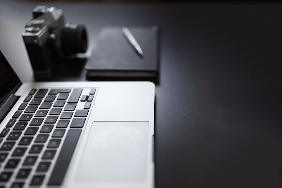 macbook, laptop, computer, technology, notepad, pen, camera HD wallpaper