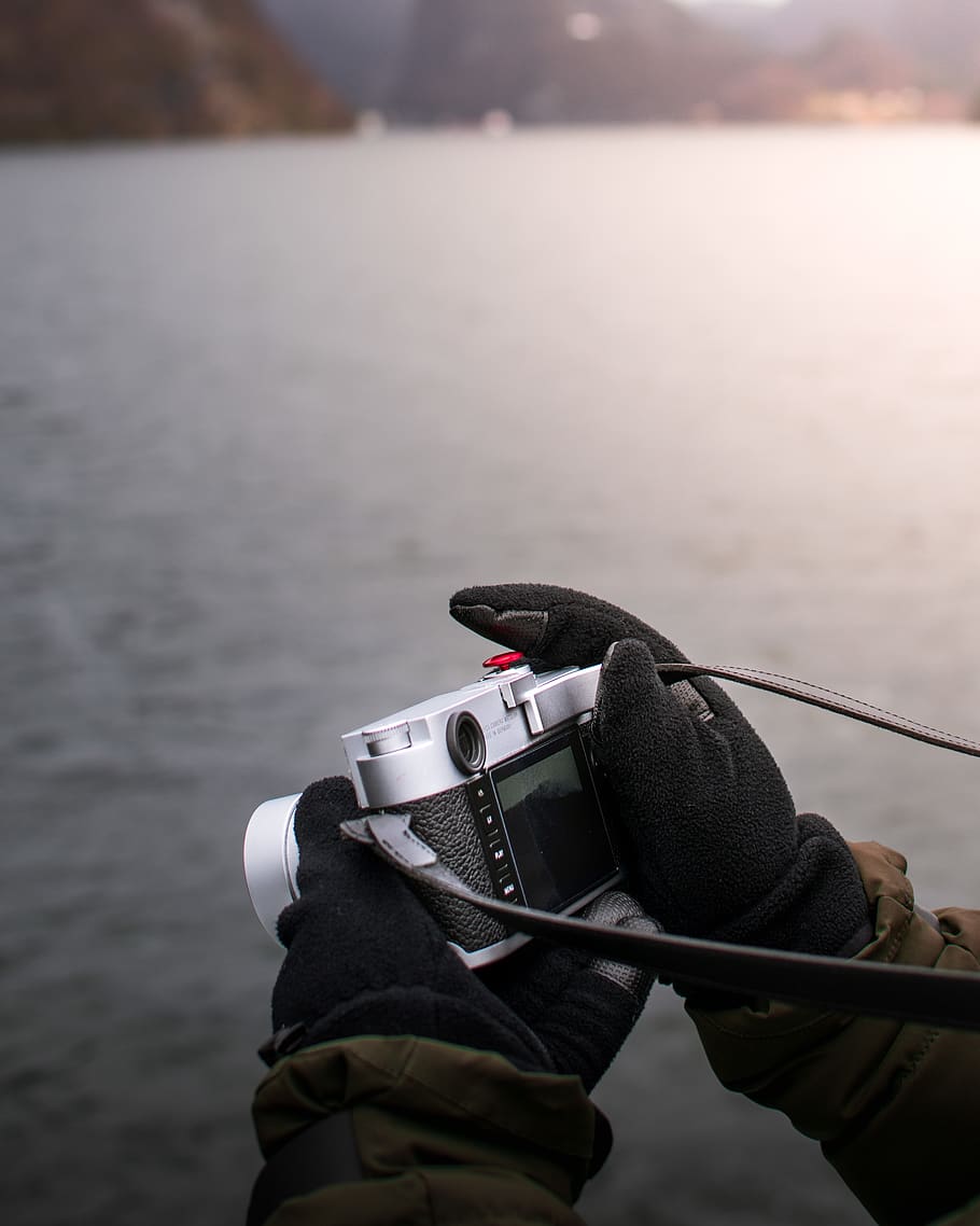 person holding digital camera, water, outdoors, leisure activities HD wallpaper