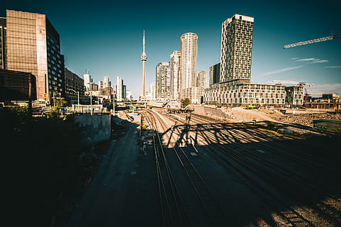train rails under blue sky, high rise, urban, city, building HD wallpaper