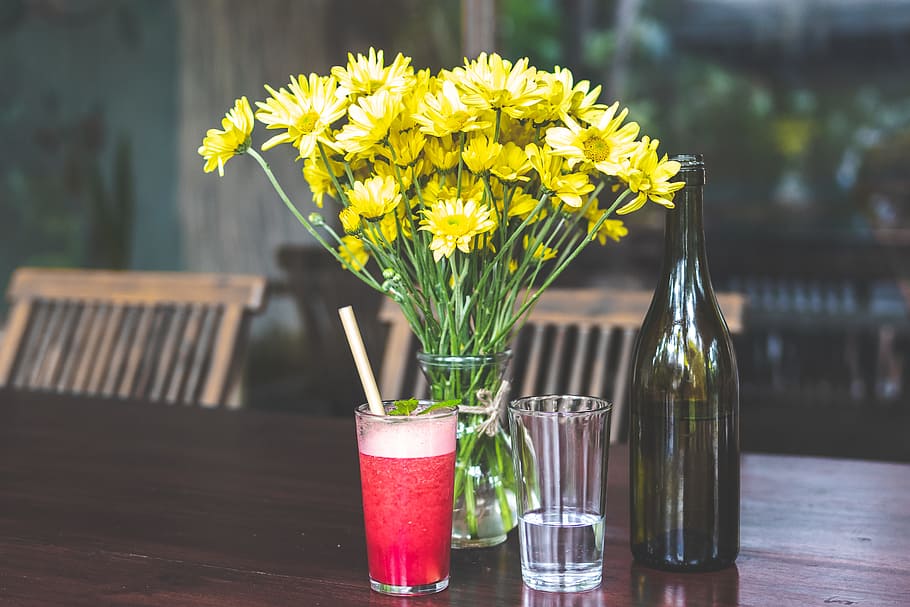Yellow Daises in Clear Glass Vase Beside Bottle, alcohol, beverage HD wallpaper