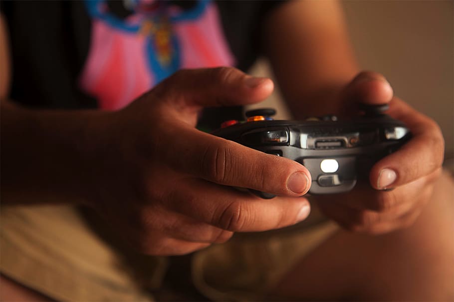 Person Holding Black Game Controller, blurred background, electronics HD wallpaper