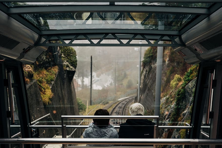 two person sitting inside cable car, human, handrail, banister HD wallpaper