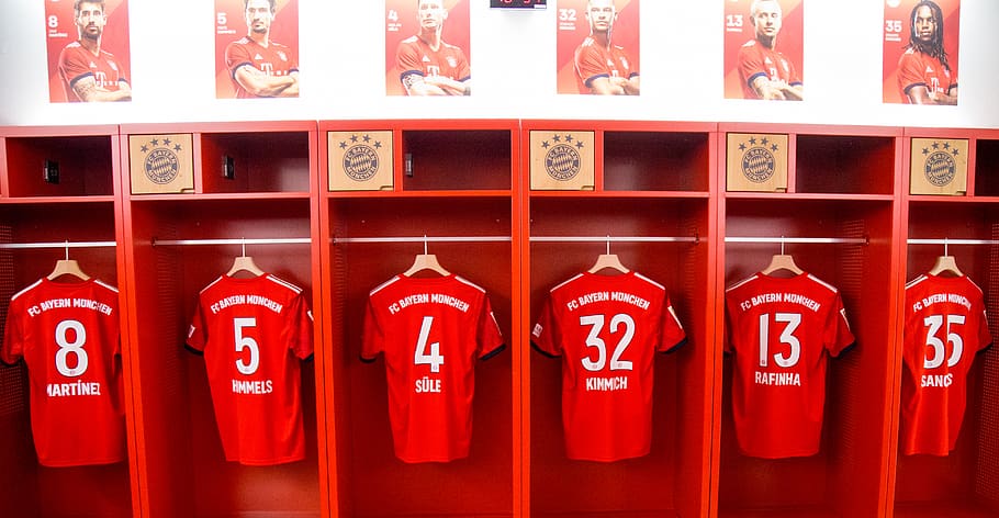 six red jerseys in locker, indoors, room, dressing room, furniture