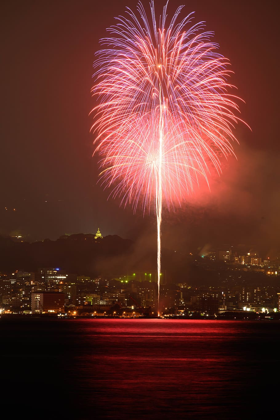 fireworks display during daytime nighttime, illuminated, motion